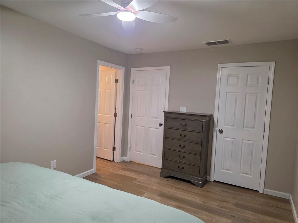 722 Lacy Street Monroe, GA 30655 - Photo 10 of 19 a view of a dresser with wooden floor