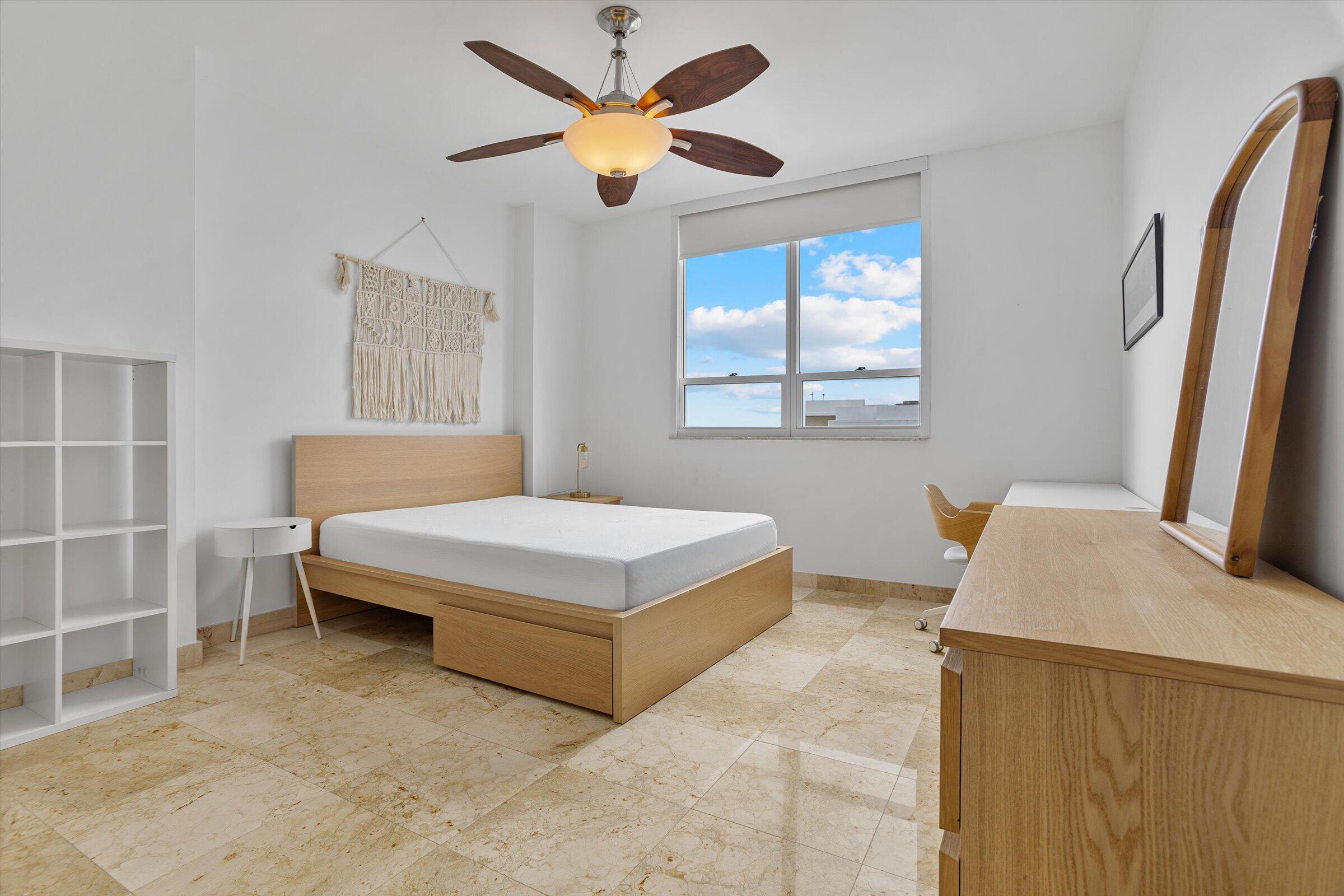 801 Brickell Key Boulevard, Unit 2805 Miami, FL 33131 - Photo 16 of 42 a bedroom with a bed and a flat screen tv