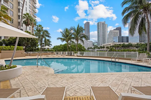 a view of a swimming pool with a patio