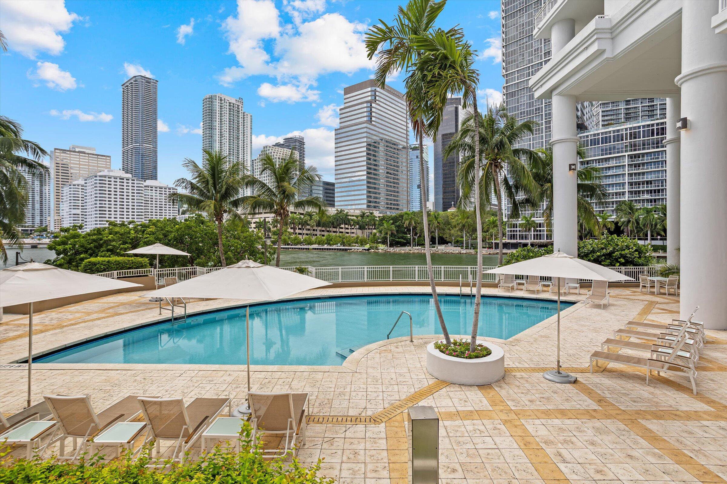 801 Brickell Key Boulevard, Unit 2805 Miami, FL 33131 - Photo 26 of 42 a view of a patio with couches and potted plants