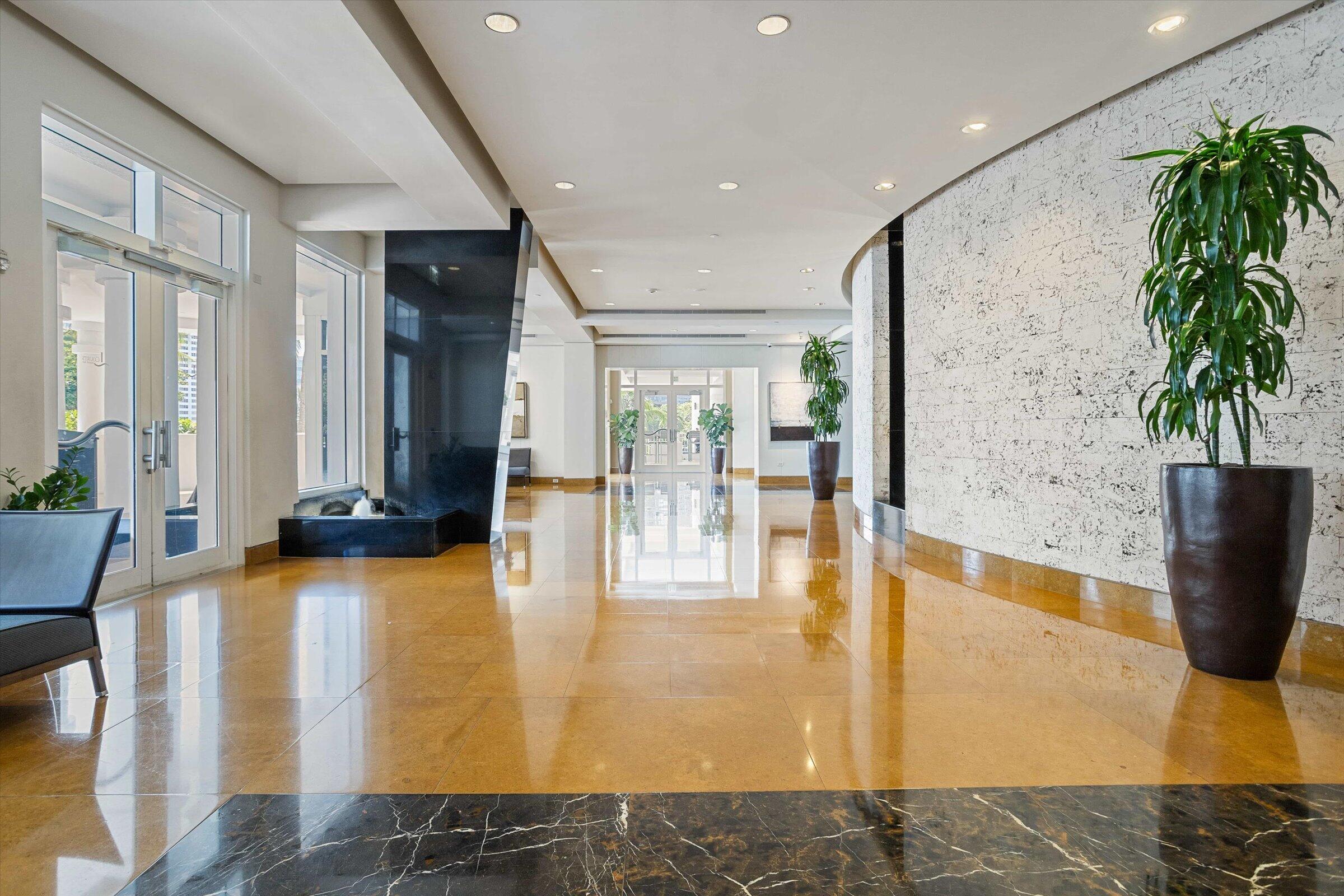 801 Brickell Key Boulevard, Unit 2805 Miami, FL 33131 - Photo 27 of 42 a lobby with furniture and floor to ceiling window