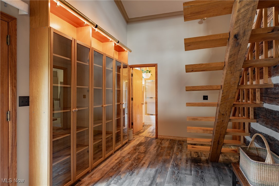 8089 Elk Fork Road Middlebourne, WV 26149 - Photo 25 of 50 Large Glass Front Book Case & Stairs to Loft, Premium LVT Flooring