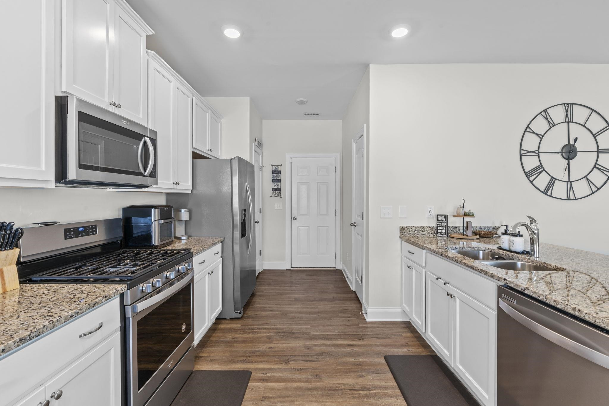 7329 Vanover Drive Raleigh, NC 27604 - Photo 8 of 30 An Abundance of Timeless White Cabinetry Including Pantry for Extra Storage