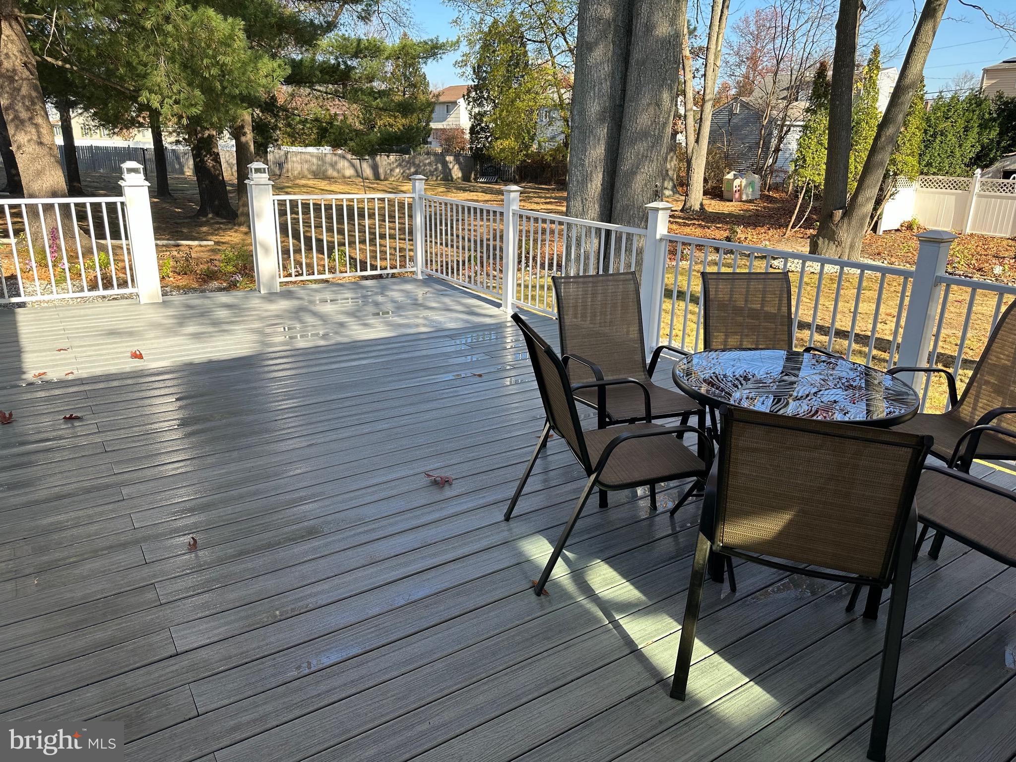 28 Cold Spring Road Hamilton, NJ 08619 - Photo 30 of 34 a view of a roof deck with table and chairs and wooden floor