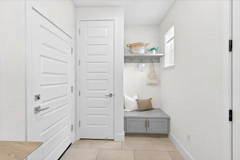a kitchen with a sink counter and chairs