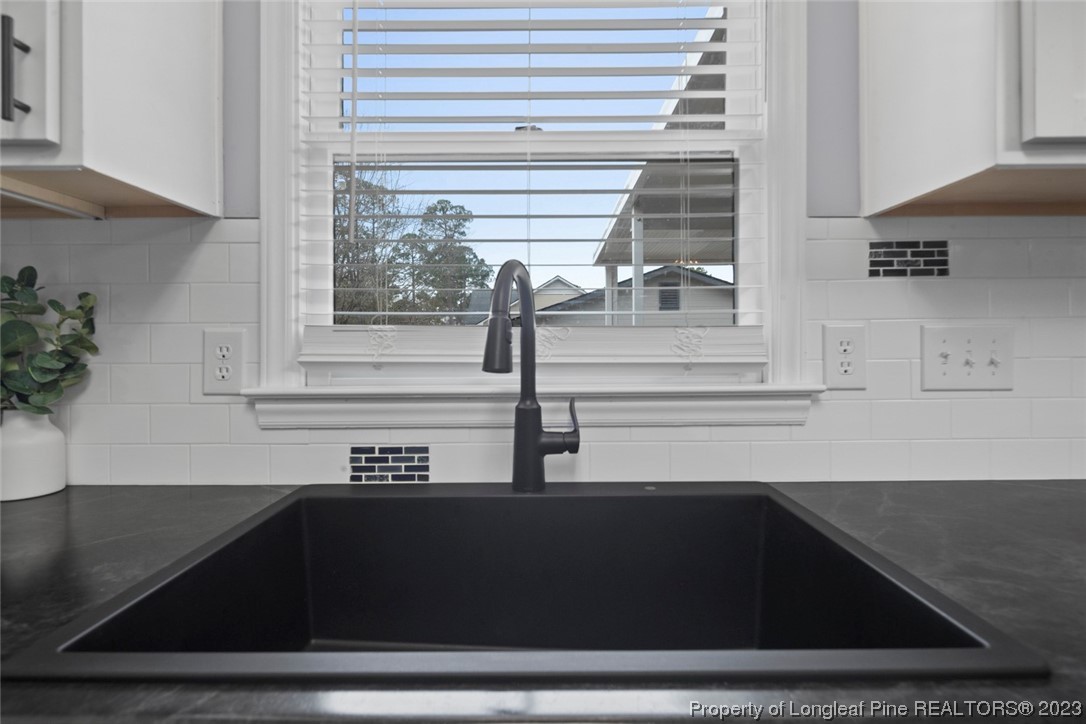 5843 Labonte Drive Hope Mills, NC 28348 - Photo 19 of 43 a kitchen with a sink and a window