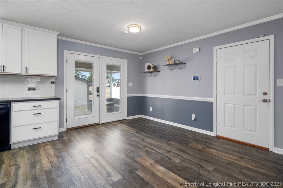 5843 Labonte Drive Hope Mills, NC 28348 - Photo 20 of 43 an empty room with cabinet and wooden floor