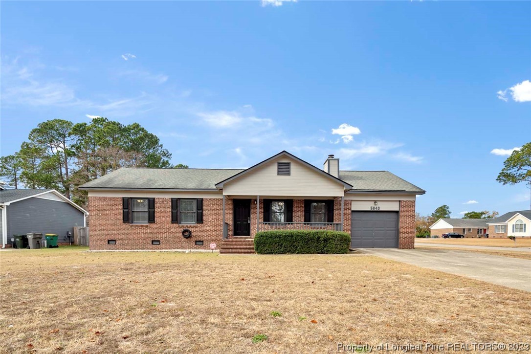 5843 Labonte Drive Hope Mills, NC 28348 - Photo 2 of 43 a front view of a house with a yard