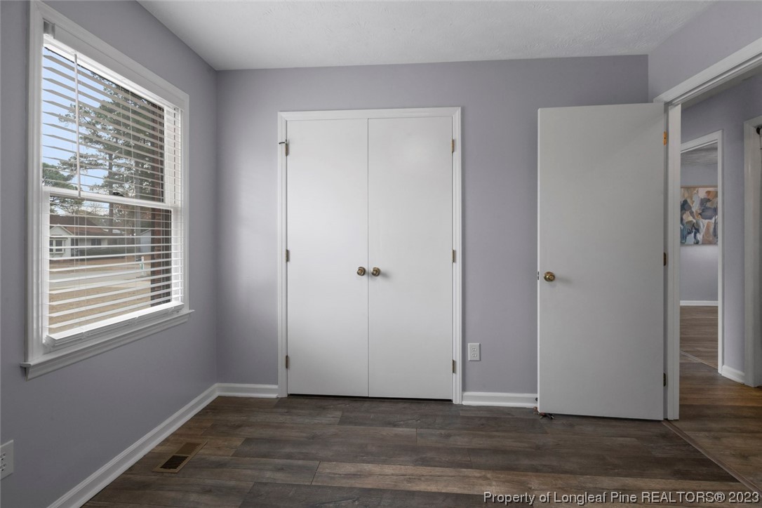 5843 Labonte Drive Hope Mills, NC 28348 - Photo 24 of 43 a view of an empty room with wooden floor and a window
