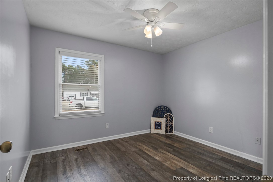 5843 Labonte Drive Hope Mills, NC 28348 - Photo 26 of 43 an empty room with wooden floor fan and window