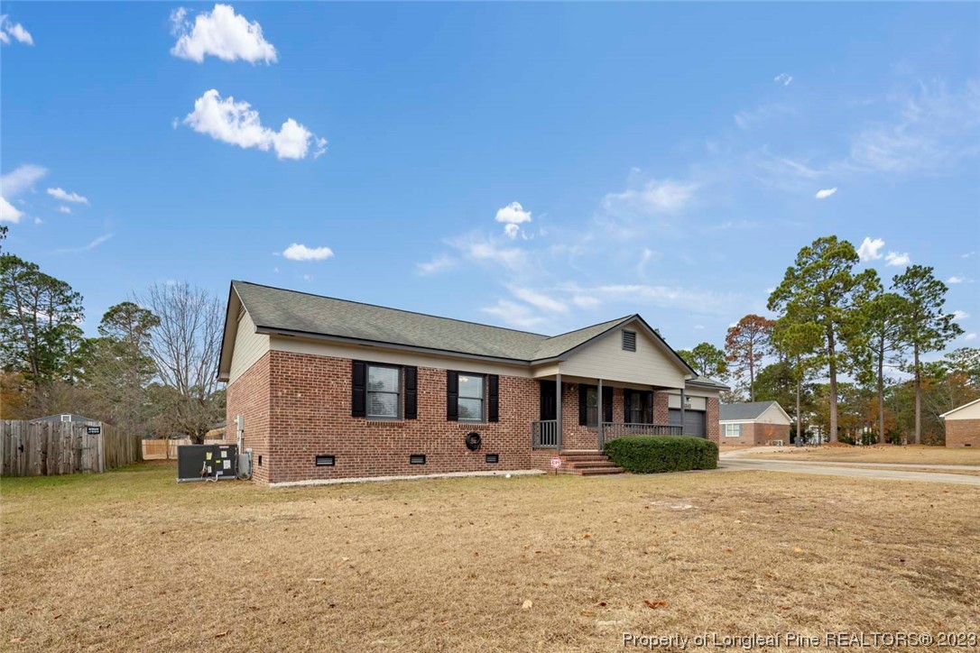 5843 Labonte Drive Hope Mills, NC 28348 - Photo 3 of 43 a front view of a house with a yard and garage