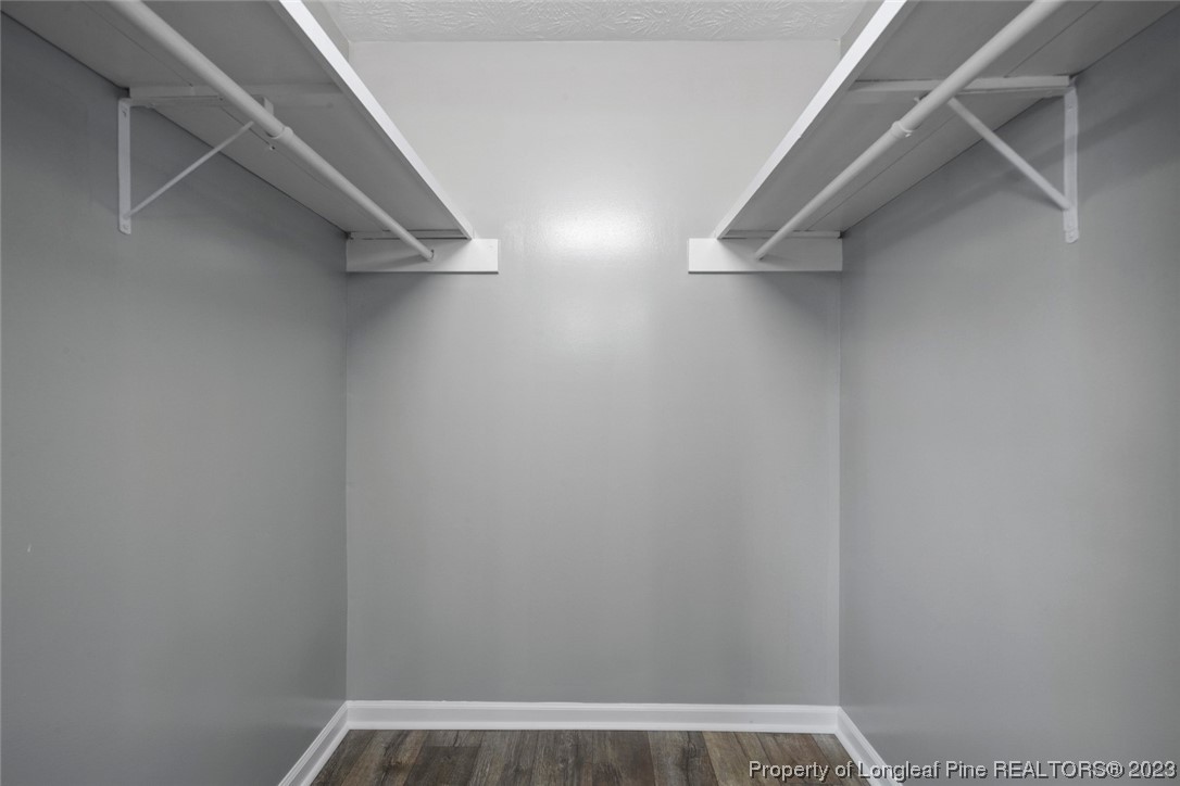 5843 Labonte Drive Hope Mills, NC 28348 - Photo 33 of 43 a view of walk in closet with empty racks