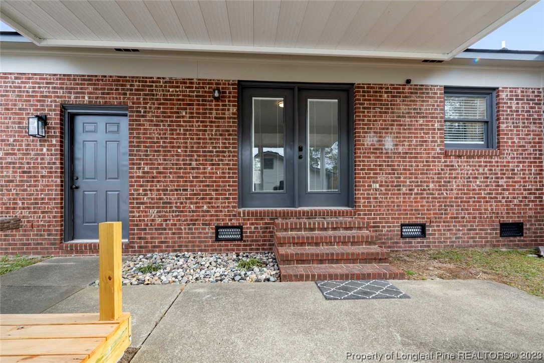 5843 Labonte Drive Hope Mills, NC 28348 - Photo 35 of 43 a brick house with a large windows