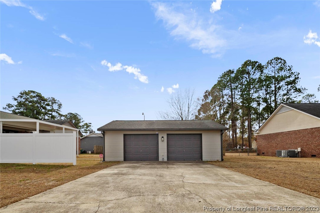 5843 Labonte Drive Hope Mills, NC 28348 - Photo 36 of 43 a view of a house with a yard and garage