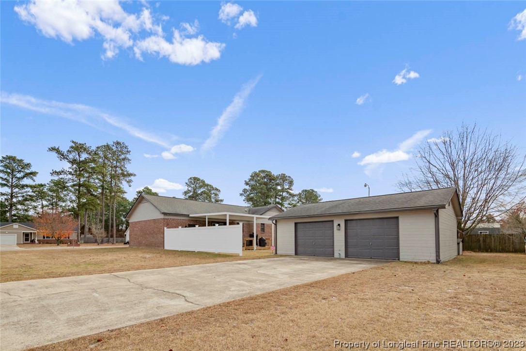 5843 Labonte Drive Hope Mills, NC 28348 - Photo 37 of 43 a front view of a house with a yard and garage