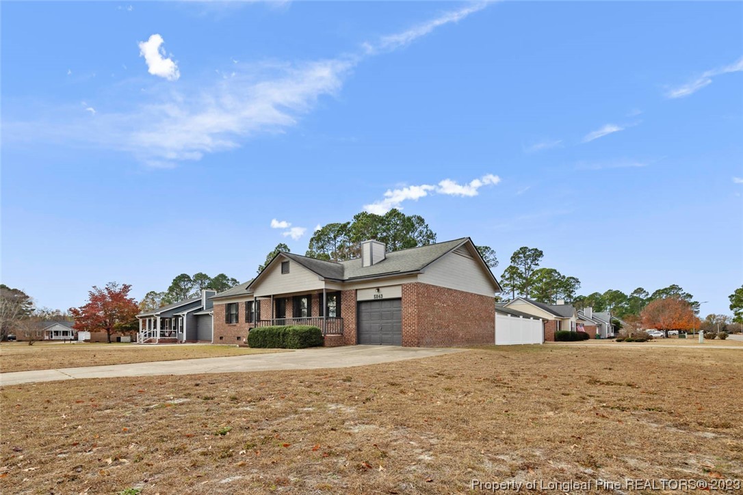 5843 Labonte Drive Hope Mills, NC 28348 - Photo 4 of 43 a front view of a house with a yard and garage