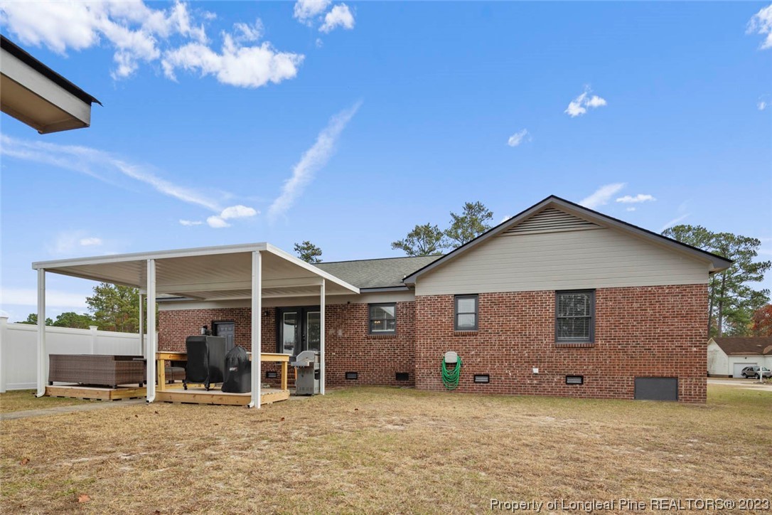 5843 Labonte Drive Hope Mills, NC 28348 - Photo 42 of 43 a front view of a house with a yard and balcony