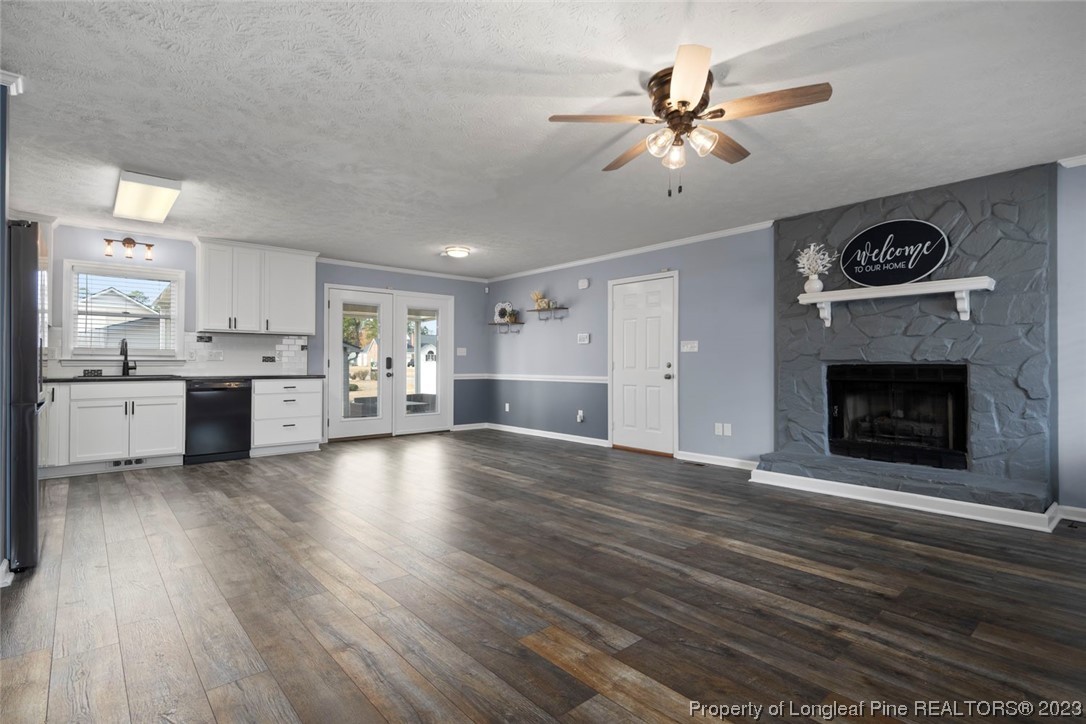 5843 Labonte Drive Hope Mills, NC 28348 - Photo 8 of 43 a view of a kitchen with a stove cabinets and a fireplace