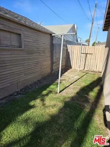 a yellow house with a yard