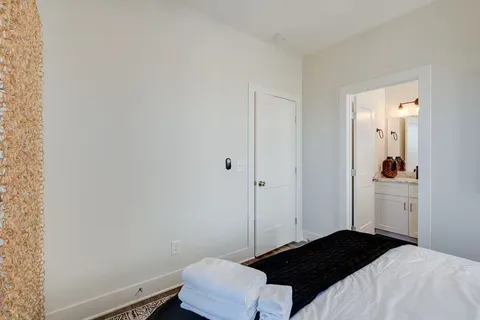 a bedroom with a bed and a closet