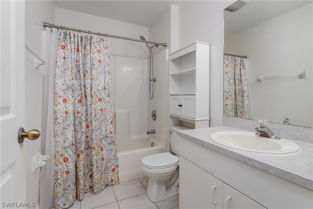 234 Connecticut Road Lehigh Acres, FL 33936 - Photo 15 of 19 a bathroom with a sink toilet and shower