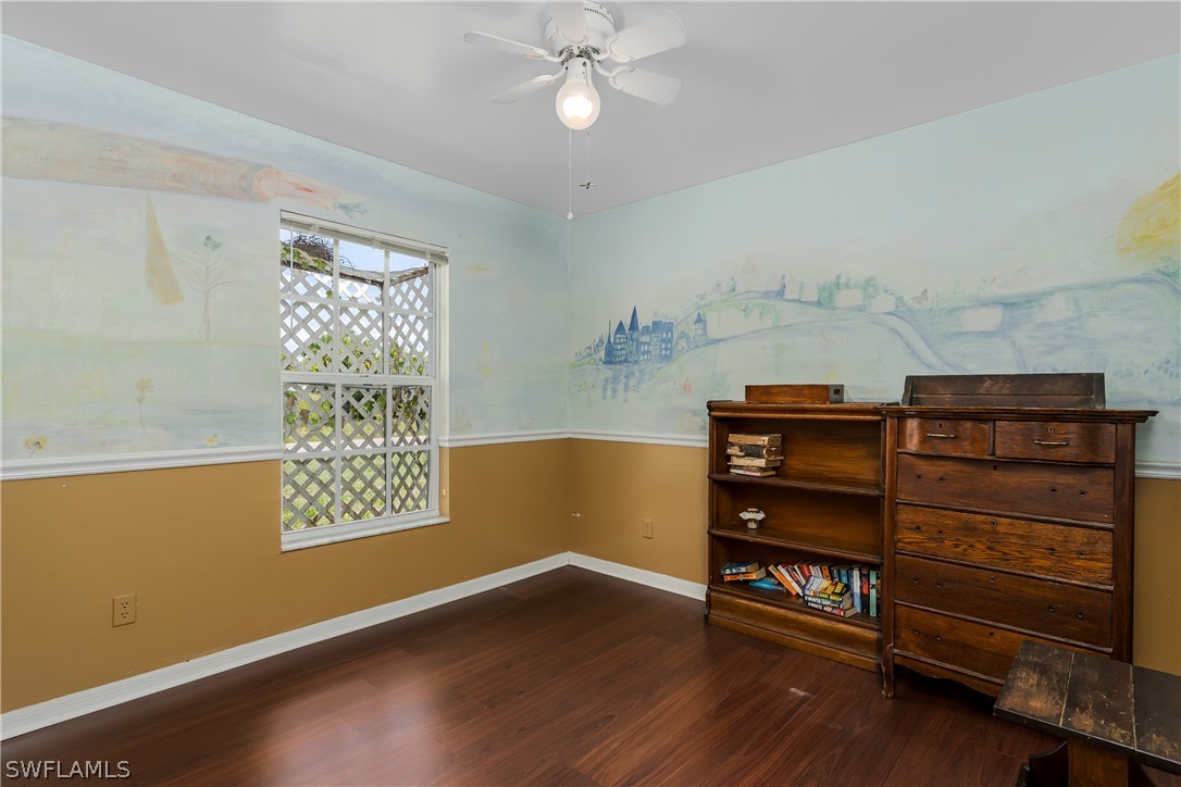 234 Connecticut Road Lehigh Acres, FL 33936 - Photo 16 of 19 a view of a room with wooden floor and cabinet