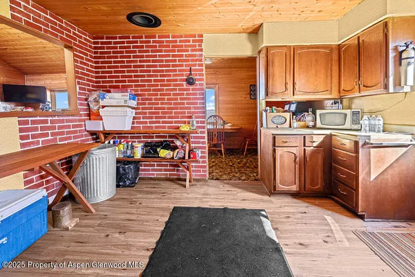 a view of a kitchen with a sink and cabinets