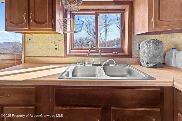 a view of a sink and a window