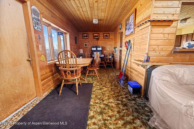 a dining room with furniture window and outside view