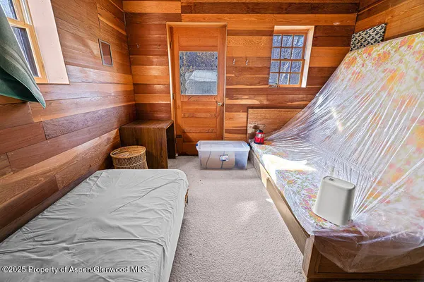 a view of balcony with couch and chairs
