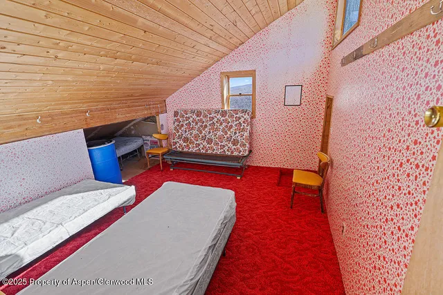 a balcony with couch and wooden floor