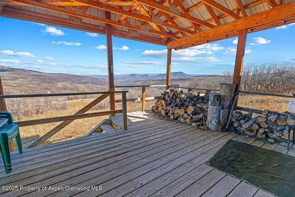 a view of balcony with wooden floor