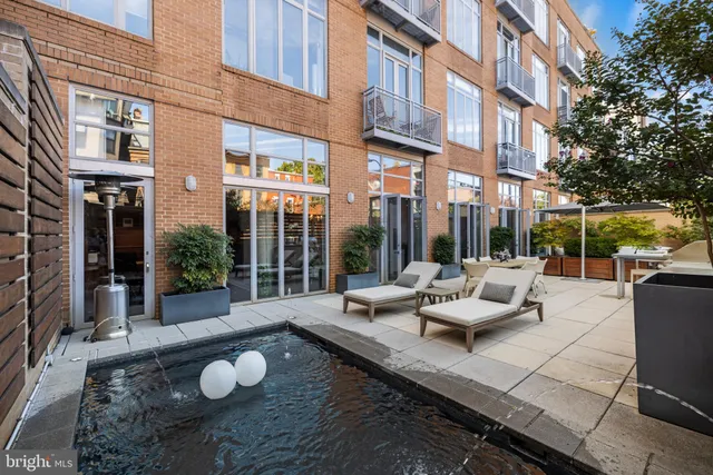 a view of a building with sitting area