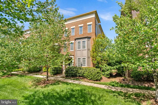 a brick building with a yard