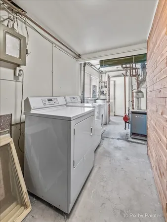 a bathroom with a shower sink vanity mirror and toilet