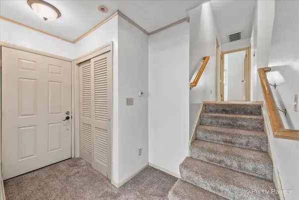 a view of an entryway with staircase