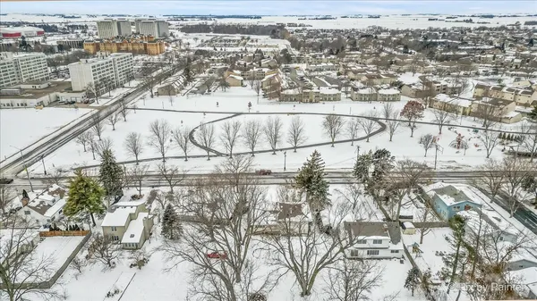 a white bench sitting in a backyard