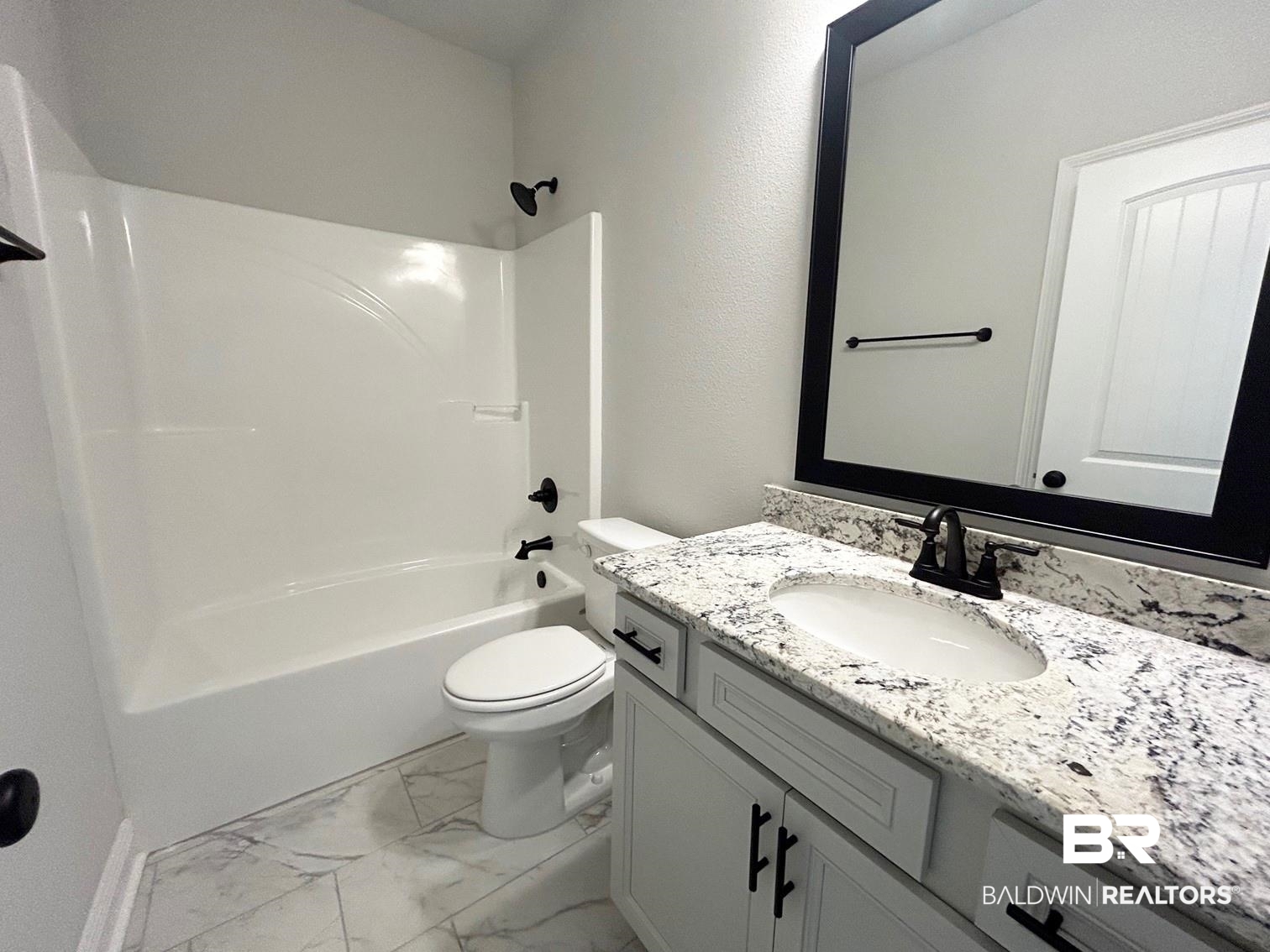 880 Sumter Loop Foley, AL 36535 - Photo 10 of 14 Full bathroom with vanity, toilet, and tub / shower combination