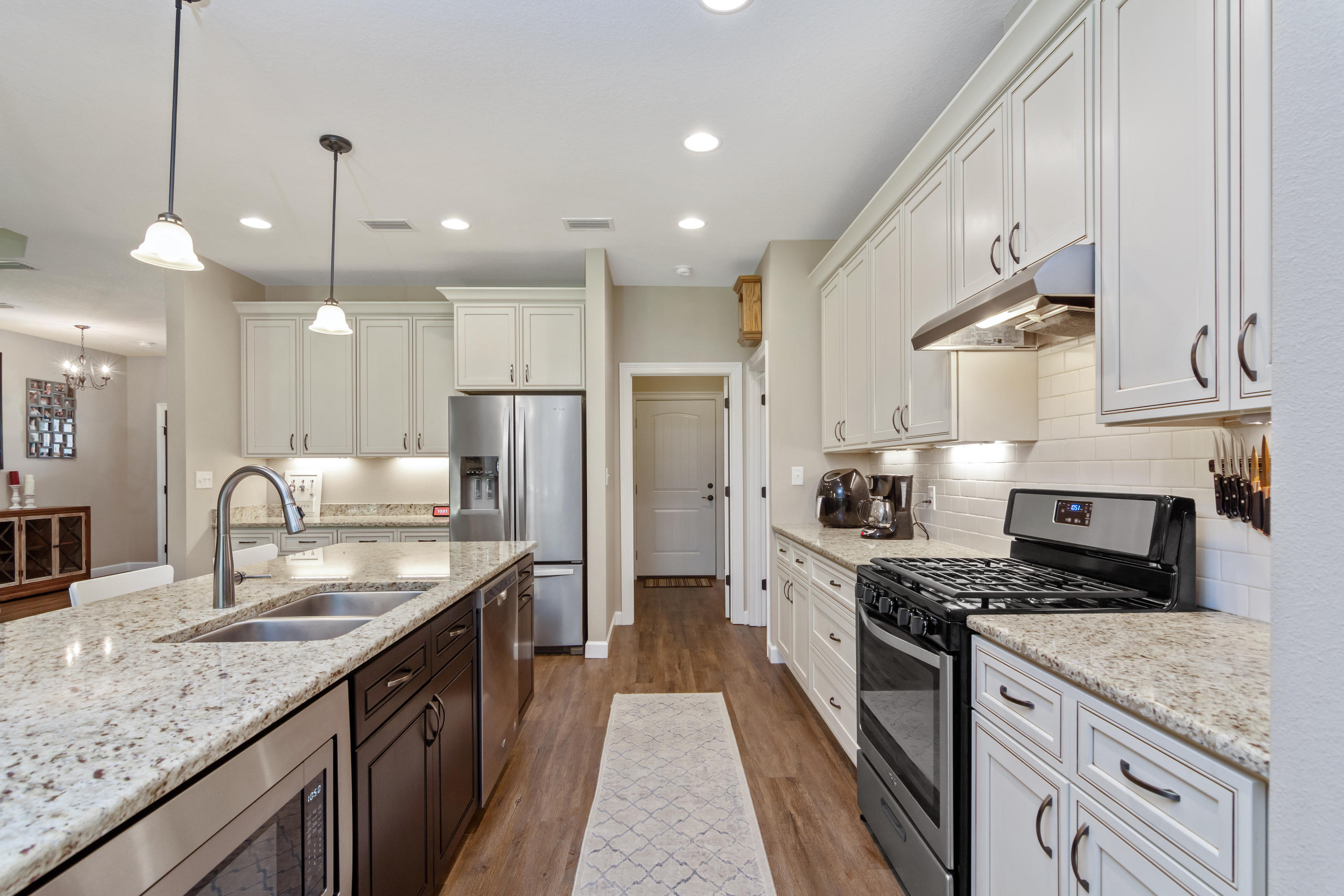6076 Carina Road Crestview, FL 32539 - Photo 20 of 38 a kitchen with stainless steel appliances granite countertop a sink stove and refrigerator