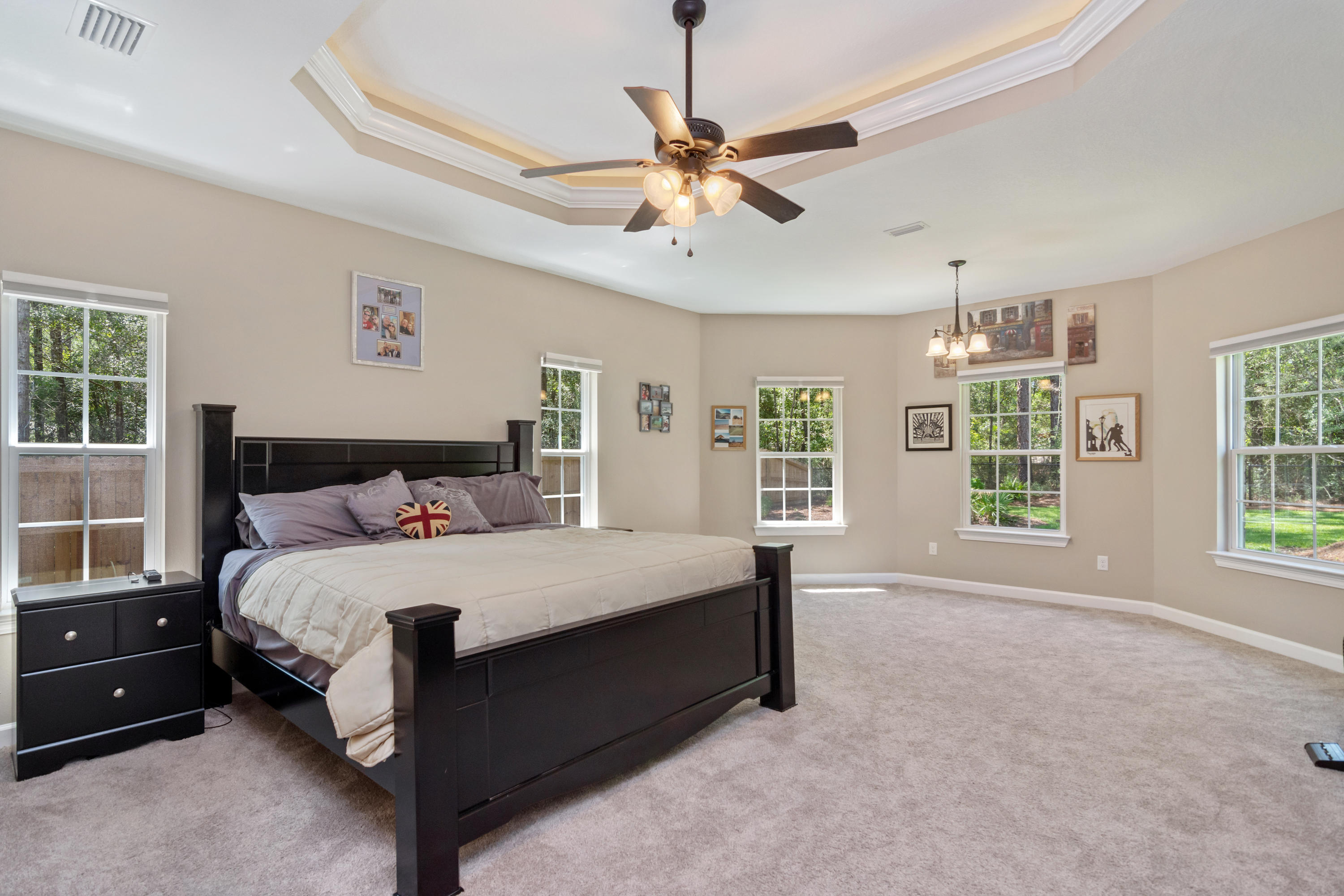 6076 Carina Road Crestview, FL 32539 - Photo 21 of 38 a large bedroom with a bed and window