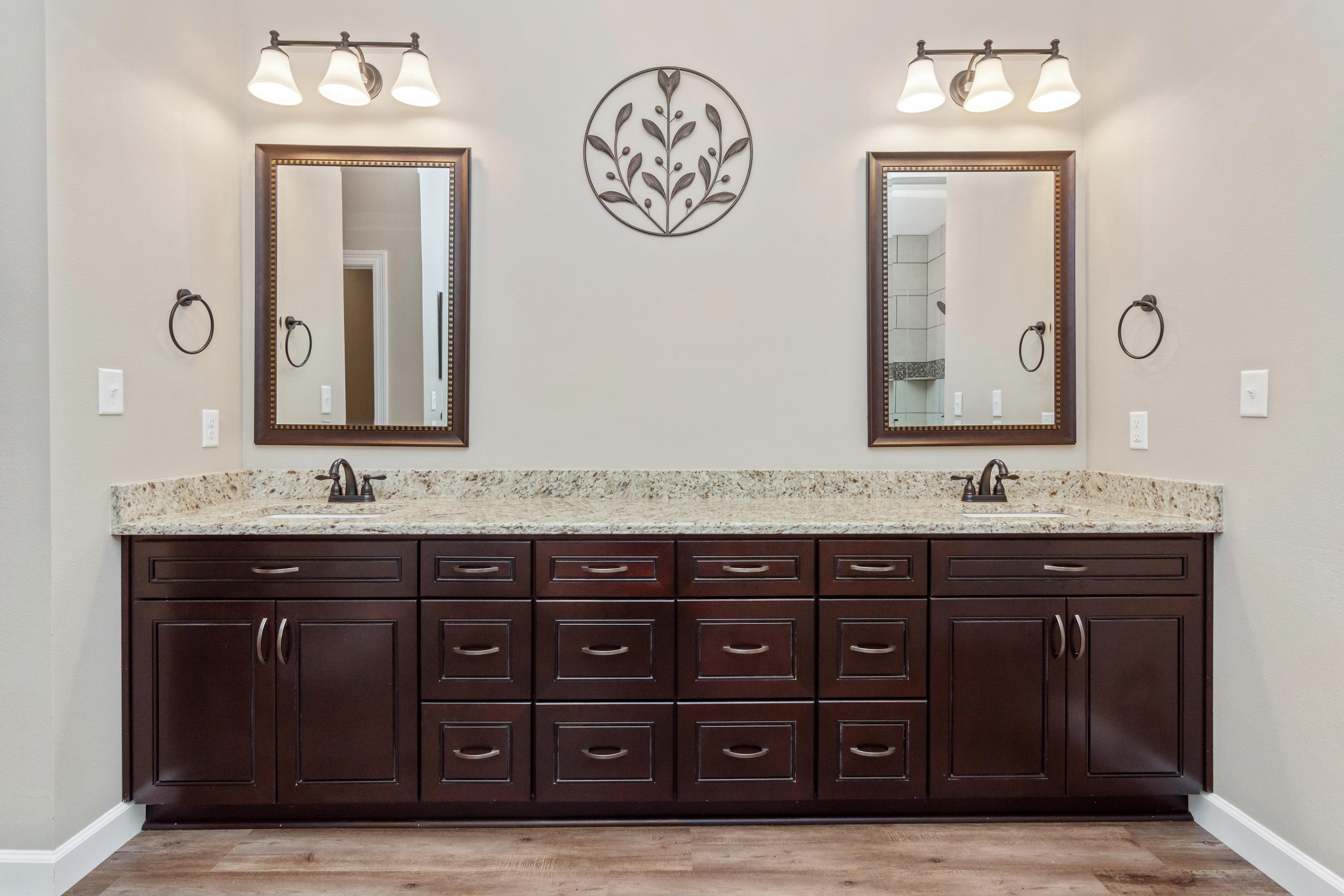 6076 Carina Road Crestview, FL 32539 - Photo 25 of 38 a bathroom with a sink double vanity and a mirror