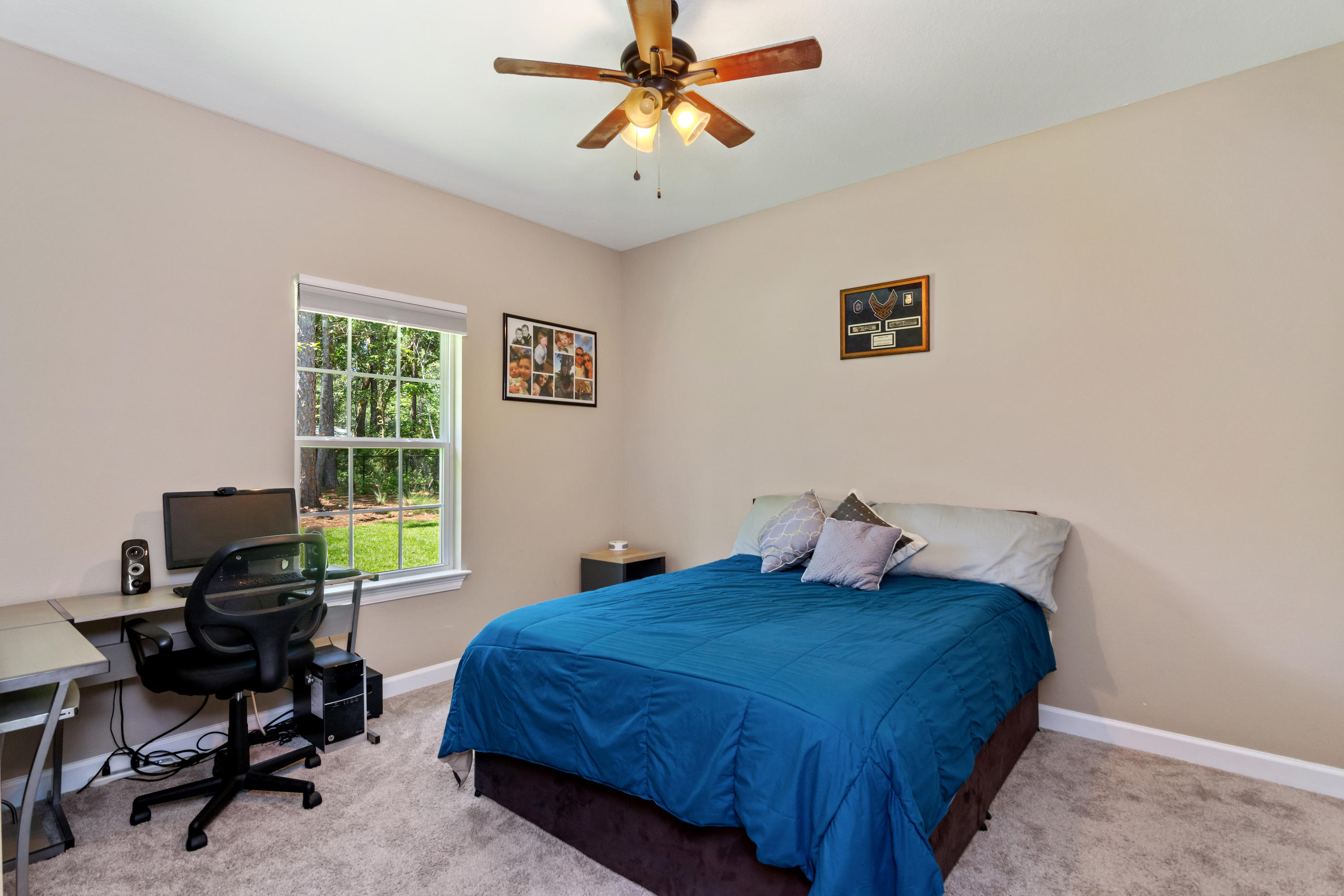 6076 Carina Road Crestview, FL 32539 - Photo 29 of 38 a bedroom with a bed and a desk