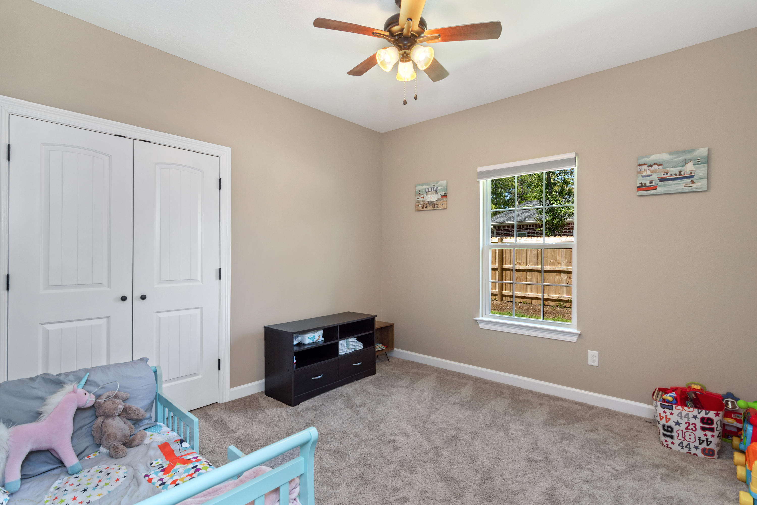 6076 Carina Road Crestview, FL 32539 - Photo 31 of 38 a living room with furniture and a window