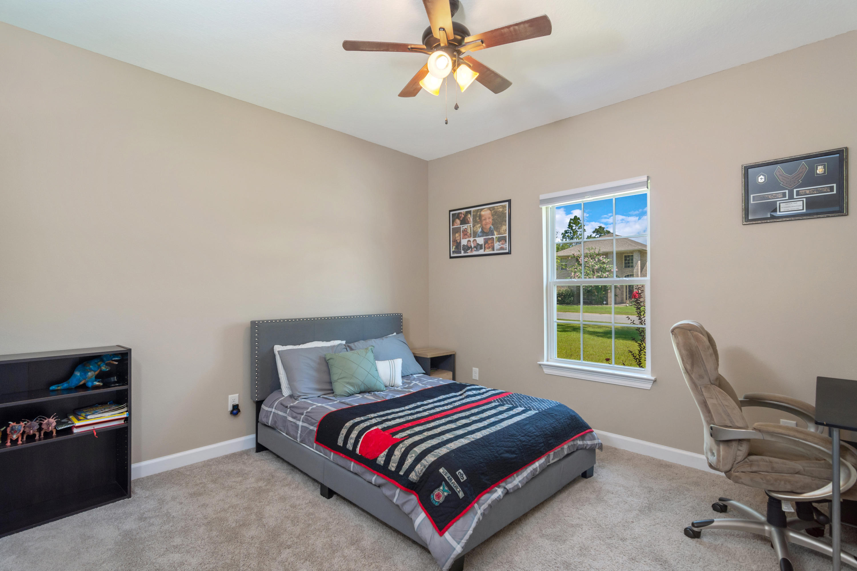 6076 Carina Road Crestview, FL 32539 - Photo 32 of 38 a bedroom with a bed and a window