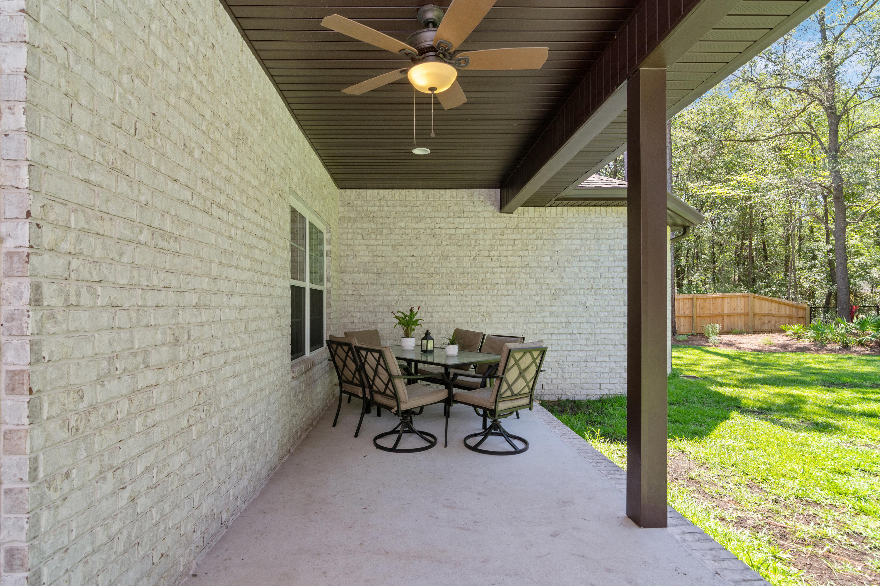 6076 Carina Road Crestview, FL 32539 - Photo 35 of 38 a view of a porch with furniture and garden