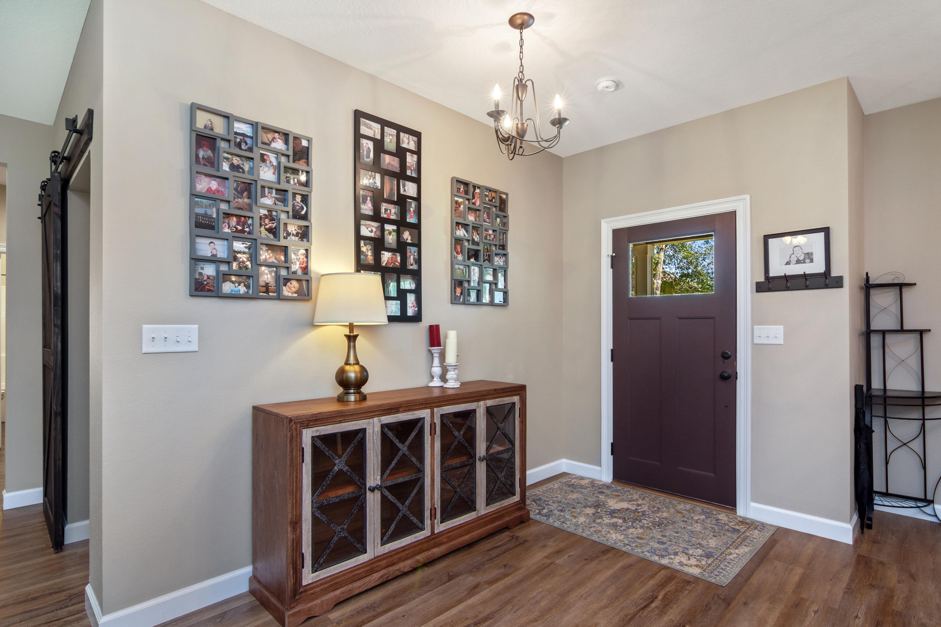 6076 Carina Road Crestview, FL 32539 - Photo 9 of 38 a view of a hallway with wooden floor and staircase