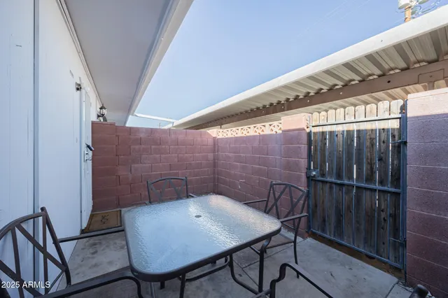a view of a balcony with furniture