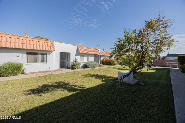 a view of a house with a yard