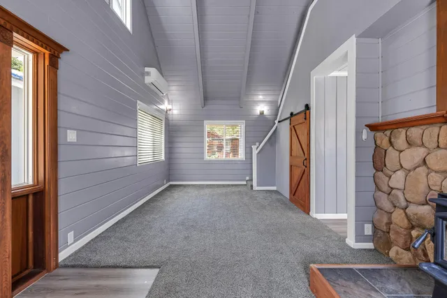 a view of an empty room with a fireplace