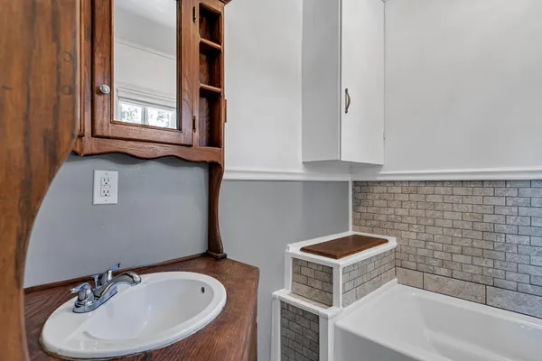 a bathroom with a sink and a mirror